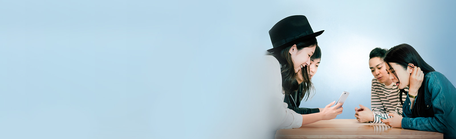 A group of youngsters using banking services over their mobile