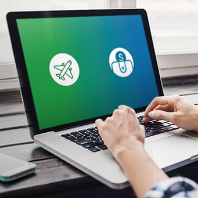 Using Laptop opening the airplane and dollar logos, used to promote Standard Chartered 360° Rewards Redemption Platform