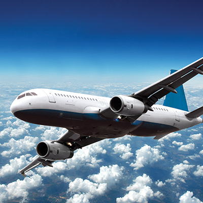 an airplane flying above the clouds and turning right