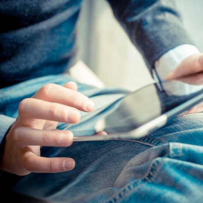 a gentleman using a tablet to enjoy SC digital banking services