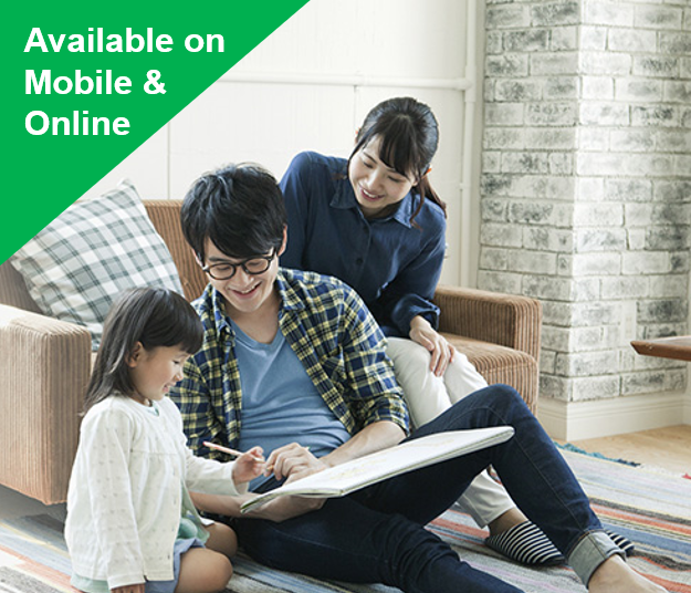 A man is reading a book to a little girl and a woman is laughing at their back