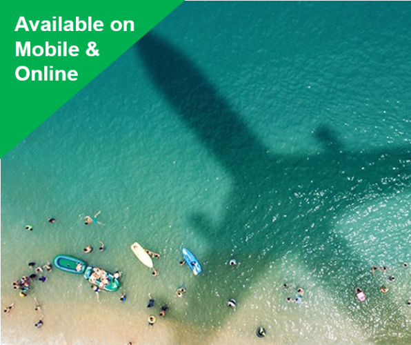 An airplane cast its shadow on a beach