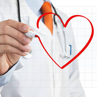 a doctor drawing a heart with a red marker