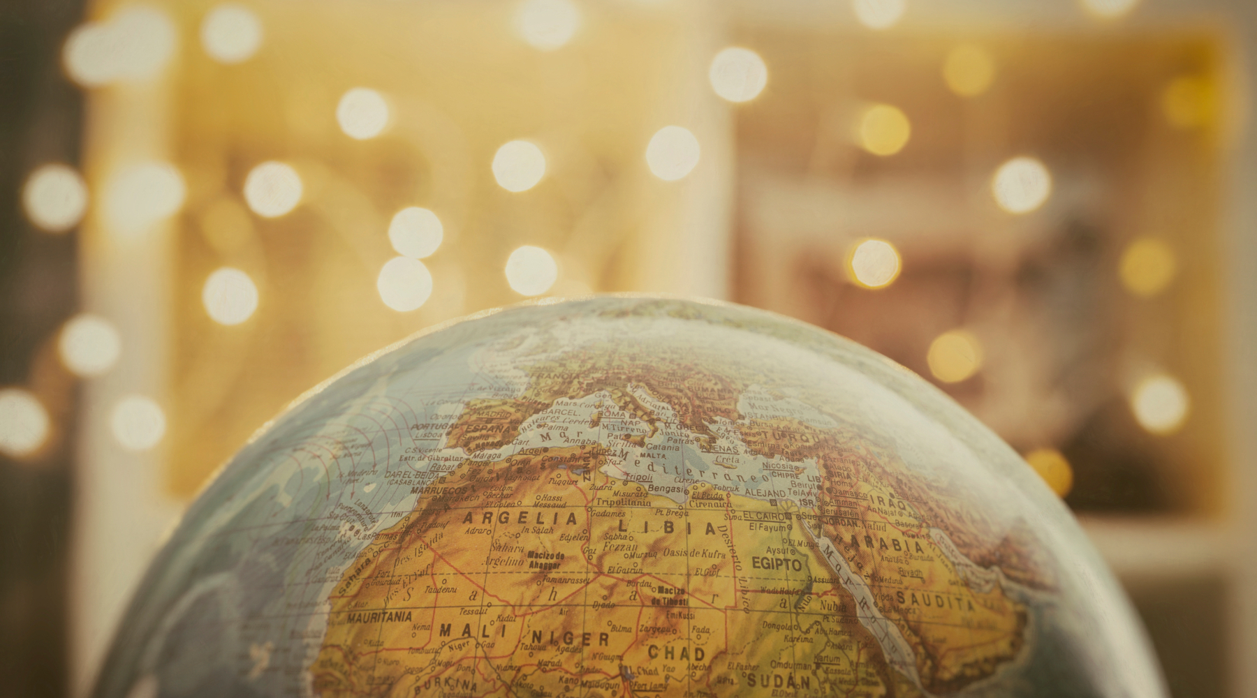 a globe looking at north africa with warm background