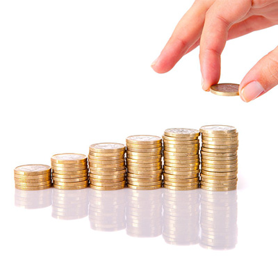 a hand stacking up coins higher from left to right