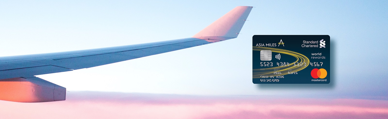 An airplane wing and Asiamiles Card face