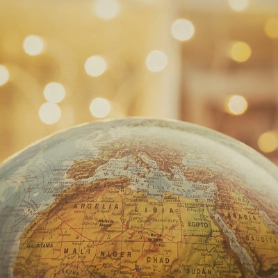 a globe looking at north africa with warm background
