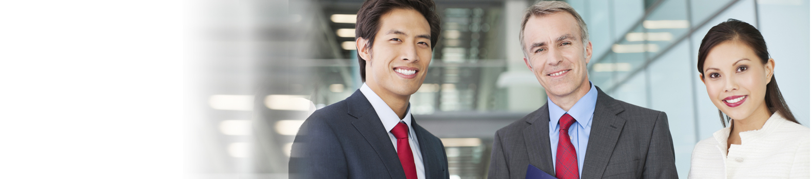 a lady, an Asian man and a western business man in suit and with red tie