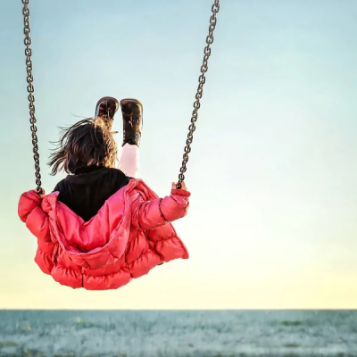 Hk stock photo little girl on the swing 